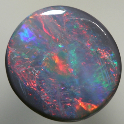 SOLID SEMI BLACK OPAL bright red moves over ocean blue green SEE VIDEO